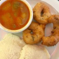 Medu Vada · 2 lightly spiced lentil flour donuts. Served with coconut chutney, sambar, and tangy spicy l...