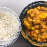 Aloo Chana · Potatoes and chickpeas in lightly spiced sauce. Served with plain white rice.