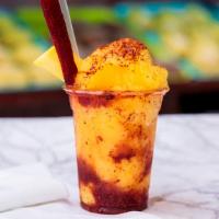  Mangonada · Mango smoothie with chamoy sauce and tajin topped with fresh mango and tamarind candy.