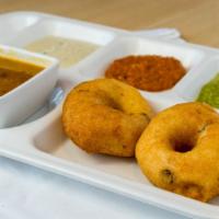 Medhu Vadai · Crispy deep fried South Indian lentil doughnut served with varieties of chutney and sambar.