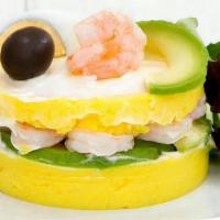 Causa De Camarones · Sculptured mashed potato infused with lime juice and yellow pepper layered with shrimp and m...