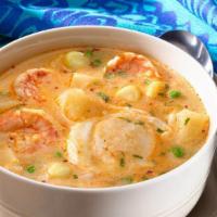 Chupe De Camarones · Peruvian style shrimp chowder made with Peruvian seasoning in a blend of rice, carrots, peas...