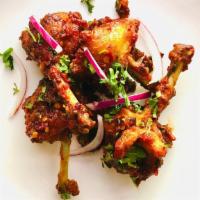 Chicken Lollipop · Chicken wing spiced with ginger, soy sauce, and chili sauce.