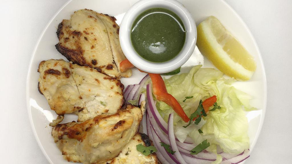 Chicken Malai Kebab · Bonelss pieces of white meat chicken marinated in mild spices, cooked in a clay oven.