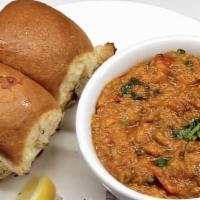 Pav Bhaji · Traditional Bombay street food consisting of vegetables (bhaji) and soft bread roll (pav).
