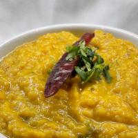 Dal Tadka · Yellow lentils cooked with cumin seeds, garlic and mild spices.