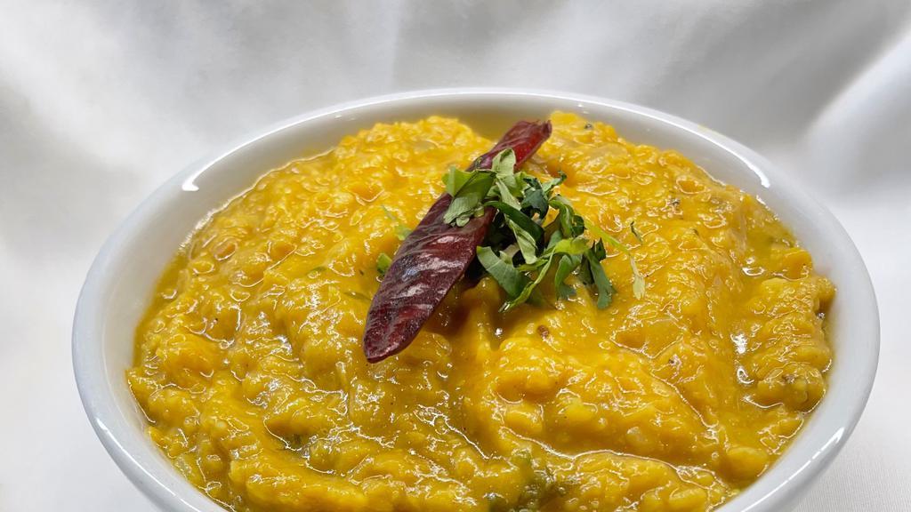 Dal Tadka · Yellow lentils cooked with cumin seeds, garlic and mild spices.