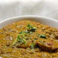 Dal Makhani · Black lentils cooked with cumin seeds, garlic, and spices.