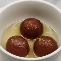 Gulab Jamun · Light pastry made from dry milk and honey.