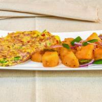 Eastern Omelette · Tomato, onions and pepper. With home fries