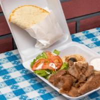 Gyro Plate · Marinated slices of beef and lamb seasoned with herb and spices. Served with hummus, salad, ...