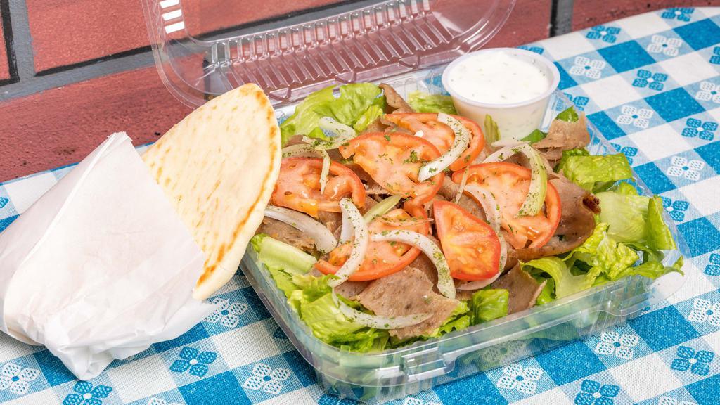 Gyro Salad · Marinated slices of beef and lamb, topped with lettuce, tomato, and onion. Served with tzatziki sauce and one pita bread.