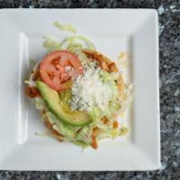Sopes · 3 fried hand crafted fried corn dough. Served with refried beans, onions, queso fresco and s...