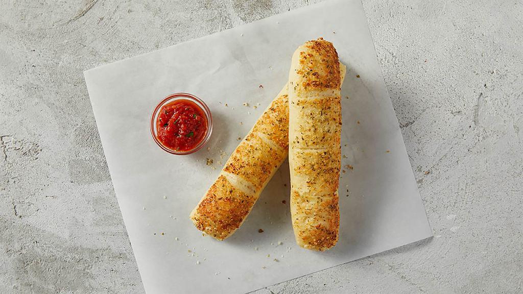 Garlic Breadstick With Sauce · Fresh dough brushed with garlic sauce, cheese and seasoning. Comes with sauce.