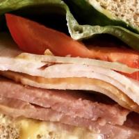 Turkey And Ham Sandwich · With mayo, honey mustard, lettuce, and tomato. Choice of bread: honey oat, whole wheat, or F...