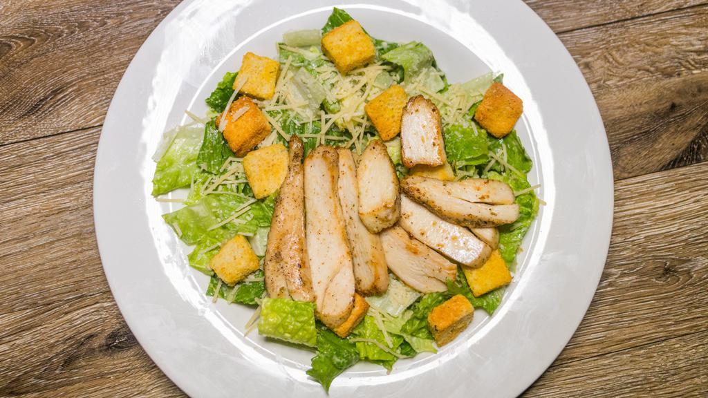 Caesar Salad · Shaved parmesan, herb croutons, romaine, and Caesar dressing. (410 Calories).