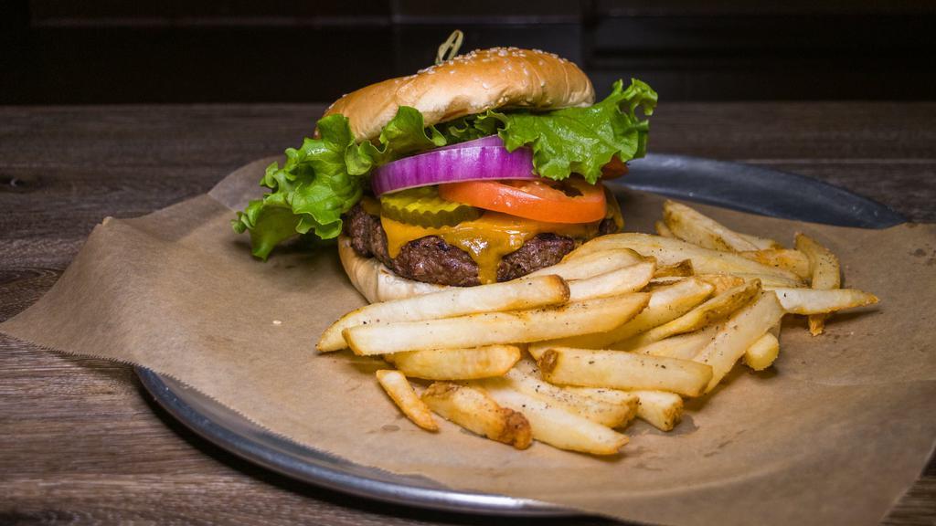 Classic Mobley Burger · Our signature 100% chuck steak burger, lettuce, pickle red onion, tomato and artisan sauce on a sesame seed bun.
