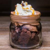 Mason Jar Chocolate Fudge Cake · Chocolate mousse, fudge cake and whipped cream drizzled with caramel sauce. (750 calories).