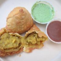 Chicken Samosa · Non-vegetarian. Crispy pastry stuffed with spiced chicken, masala and peas.