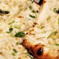 Garlic Naan · Bread topped with fresh garlic, coriander leaves and roasted in clay oven.