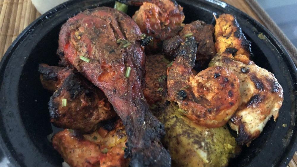 Tandoori Chicken · Chicken legs marinated with authentic Indian spices and yogurt, grilled in the day oven.