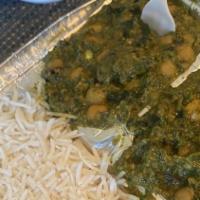 Chana Saag · Chickpeas and spinach cooked with thin curry sauce, fresh tomatoes, and spices.