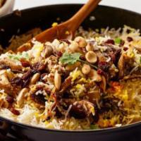 Chicken Biryani · Indian basmati rice cooked with boneless chicken, fresh mint and saffron flavor.