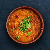 Dal · Slow-cooked lentils tempered with herbs and whole red chillies.