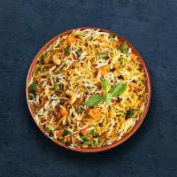 Vegetable Dhum Biryani · Long grain basmati rice cooked with farm-fresh vegetables and aromatic Indian herbs.