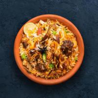 Goat Dhum Biryani · Tender goat meat and slender aromatic rice cooked in a pot in a traditional 'Dum' style.