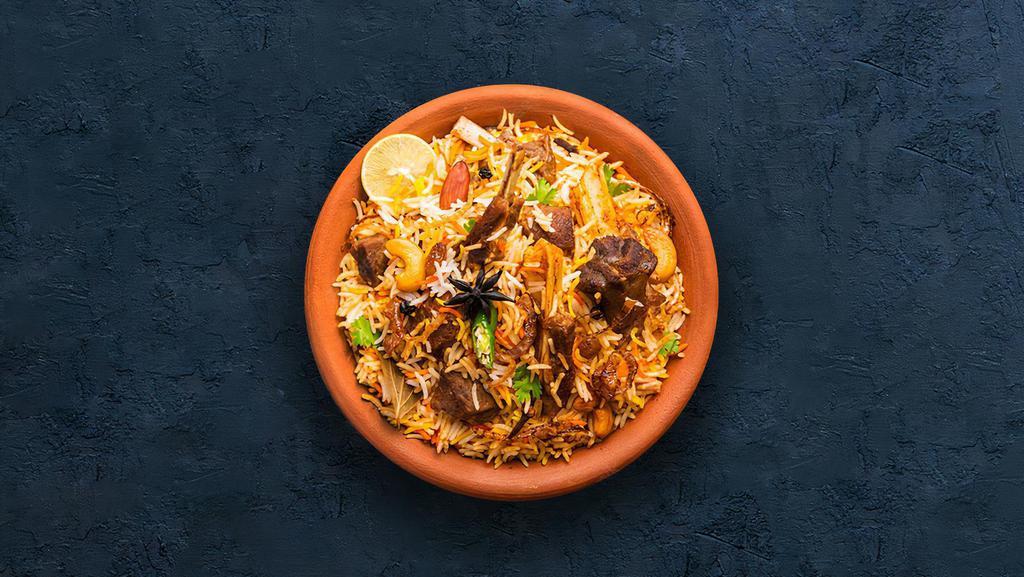Goat Dhum Biryani · Tender goat meat and slender aromatic rice cooked in a pot in a traditional 'Dum' style.