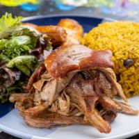Pernil · Our famous garlicky roast pork seasoned and prepared in the Puerto Rican tradition (cooked f...