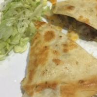 Steak Quesadilla · Includes steak, peppers, onions and cheddar jack shredded cheese.  Served with fresh guacamo...