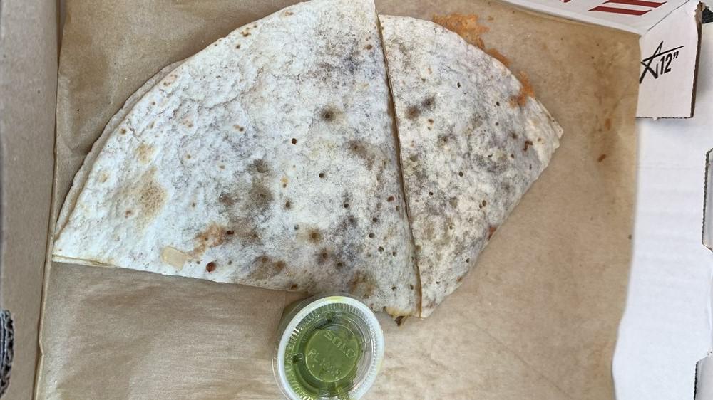 Veggie Quesadilla · Includes carrots, mushrooms, peppers, onions and cheddar jack shredded cheese.  Served with fresh guacamole and sour cream.
