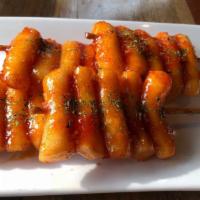 Rice Cake Skewers [ 4Pc ] · 떡꼬치 (Deok Gochi),
Fried rice cake on skewers tossed in house special sweet chili sauce.