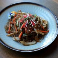 Japchae · Korean glass noodle stir-fried with vegetable and crab sticks. Served with pickles and side ...