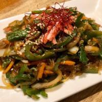 Spicy Japchae · Korean glass noodle stir-fried with spicy pepper, vegetables, and crab stick. Served with  s...