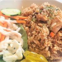 Chicken Teriyaki Fried Rice · Chicken teriyaki fried rice served with pickles, side salad, and signature coleslaw.