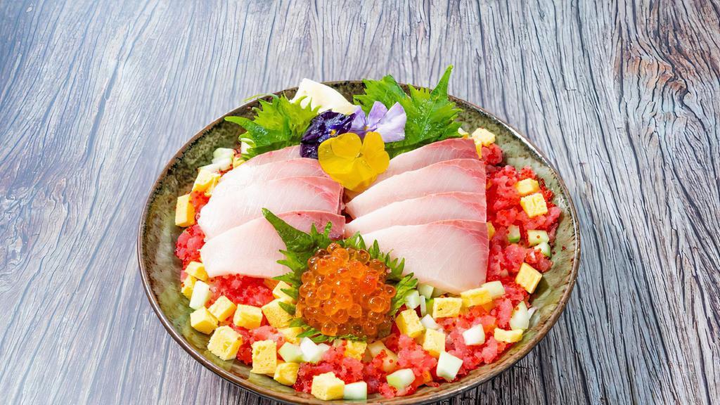 Yellowtail Chirashi Bowl · 8 oz. yellowtail, tuna ground, ikura, tamago, cucumber, shredded nori , pickled ginger and wasabi