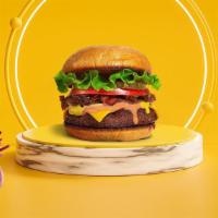 Vegan Classic Cheeseburger · Seasoned Beyond meat patty topped with vegan cheese, lettuce, tomato, and ketchup served on ...