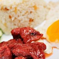 Tosilog Breakfast · Sweet marinated pork. Served with garlic fried rice and eggs.
