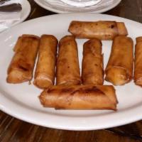 Banana Turon (8 Pcs) · Plantains with sugar wrapped in egg roll wrapper.