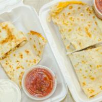 Steak Quesadilla · Served with sour cream and salsa