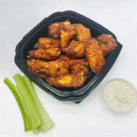 Buffalo Wings · With blue cheese and celery sticks