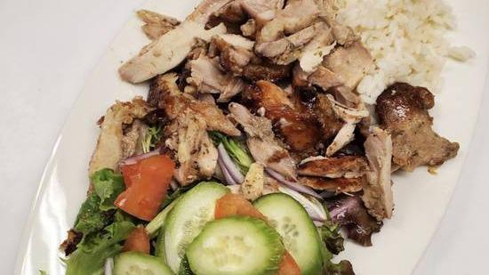 Gyro On The Plate · Delicious Chicken or Pork gyro fresh from the spit, rice, salad, pita