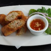 Egg Roll · Wrapped and deep-fried ground pork, shrimp, mixed veggies, and glass noodles. Served with ca...