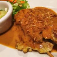 Chicken Satay · Curry-marinated chicken. Served with peanut sauce and cucumber salad.