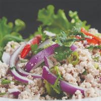 Laab · Choice of minced protein, onions, cilantro, mint, chili flakes, and roasted sticky rice powd...