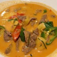 Panang Curry · Spicy.  

Panang curry with peppers, Thai basil, and lime leaf in coconut milk. Served with ...