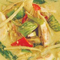 Green Curry (Gang Kiew Wan) · Spicy.  

Green curry with bamboo shoots, peppers, Thai eggplant, and fresh Thai basil in co...